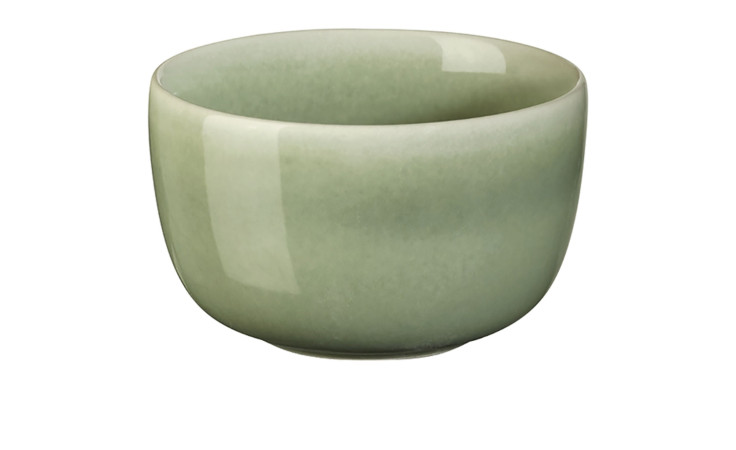 Die Schale Saisons 9 cm von ASA Selection ist eine kleine, runde, hellgrüne Schale aus Steinzeug mit einer glänzenden Oberfläche.