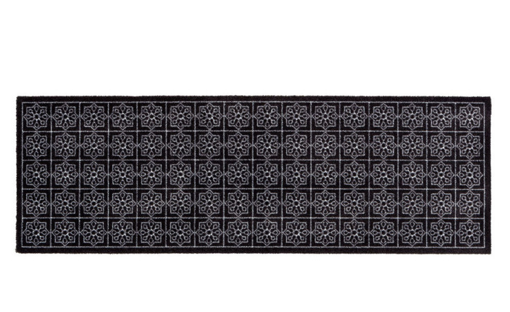 Astra Fußmatte Miabella 50x150 cm: schwarzer Nylonteppich mit weißem, geometrischem Blumengittermuster.
