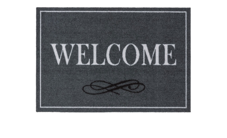 Astra Fußmatte Homelike 40x60 cm, Polyamid, mit weißem WELCOME und schwarzem Schnörkel-Design.
