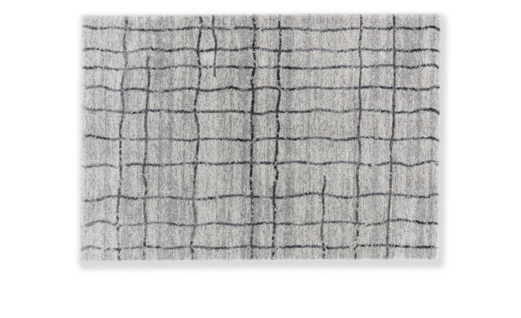 Astra Teppich Savona 160x230 cm mit unregelmäßigem schwarzem Gittermuster vor weißem Hintergrund von oben.
