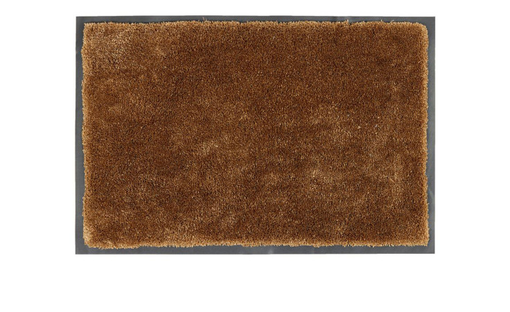 Astra Fußmatte Lava 40 x 60 cm, rechteckige braune zottelige Polyester-Fußmatte auf weißem Hintergrund.