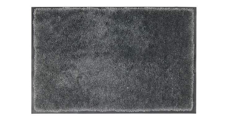 Die Astra Fußmatte Lava 40 x 60 cm ist ein anthrazitfarbener Zottelteppich mit einer weichen, strukturierten Polyesteroberfläche und ungleichmäßigen Fasern.