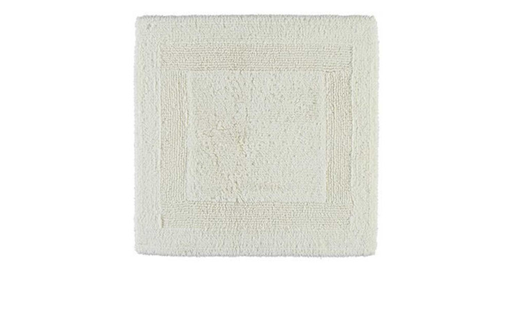 Der Cawö Wende-Badteppich 60 x 60 cm ist ein quadratischer beiger Badteppich mit strukturiertem Rand, abgebildet auf weißem Hintergrund.