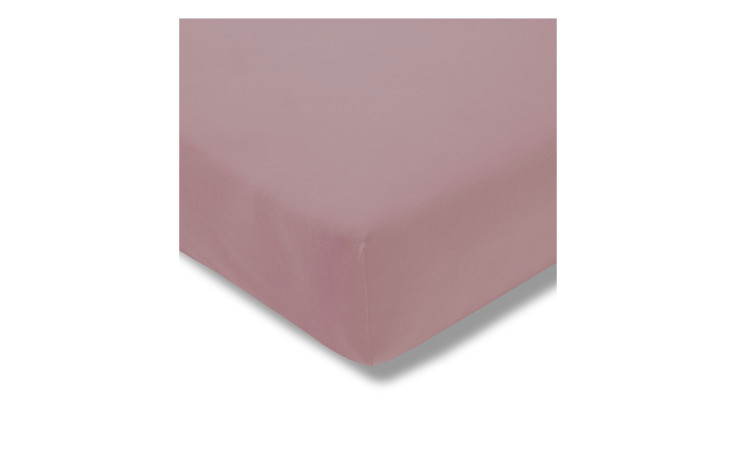 Eine Nahaufnahme eines Estella Jersey-Spannbettlakens 100 x 200 cm in rosa, das eine Matratzenecke vor weißem Hintergrund bedeckt.