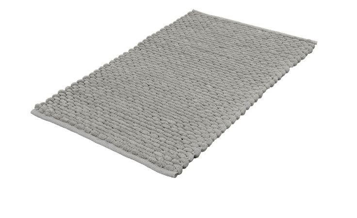 Der Kleine Wolke Badteppich Willow 60 x 100 cm in grau hat eine erhabene Punktstruktur auf weißem Hintergrund.