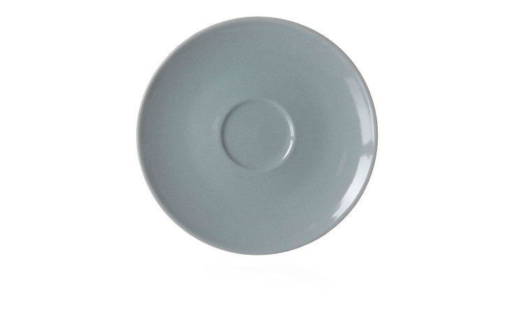 Die Ritzenhoff & Breker Espressountertasse Suomi 12 cm ist eine schlichte, runde Untertasse mit einem kleinen erhabenen Mittelpunkt.