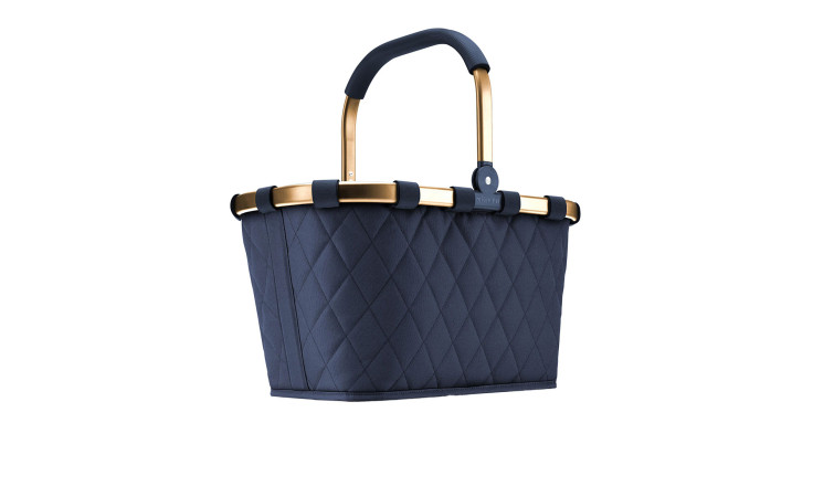 Der Reisenthel Einkaufskorb Carrybag ist eine marineblaue Stepptasche mit goldenen Verzierungen, schwarzem Griff und 3D-Steppdesign.