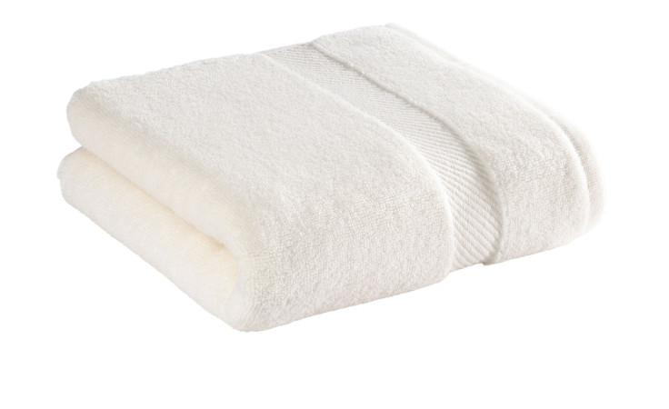 Casa Nova Handtuch 50 x 100 cm in Champagner mit dekorativem Band, gefaltet auf weißem Hintergrund.