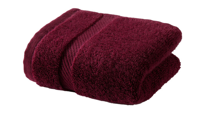 Ein gefaltetes Vossen Gästetuch 30 x 50 cm mit einem strukturierten Streifen, isoliert auf einem weißen Hintergrund.