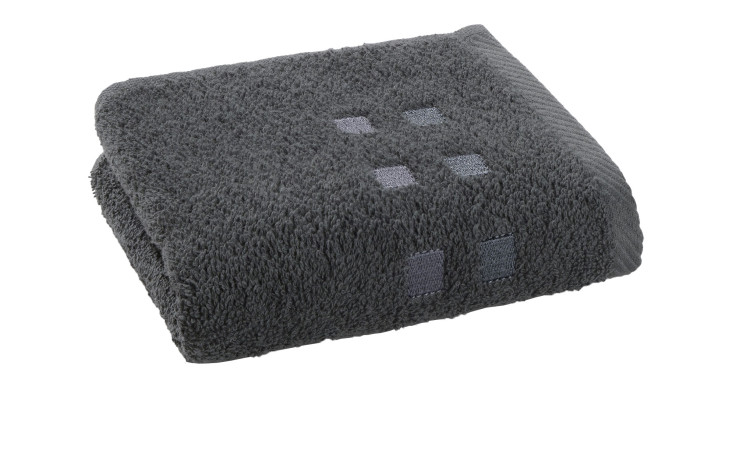 Das Casa Nova Gästetuch Quattri 30 x 50 cm ist ein anthrazitfarbenes Handtuch mit kleinen quadratischen Mustern auf Weiß.