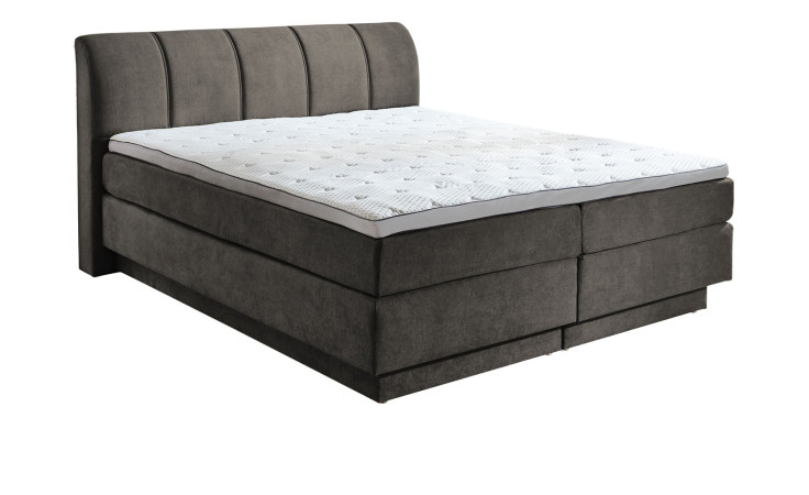 Boxspringbett Ole in Taupe aus einem Stoffbezug.