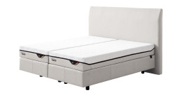 Boxspringbett Discovery Classic in einem Bezug in White Fabric in Stoff. Schräge Seitenansicht