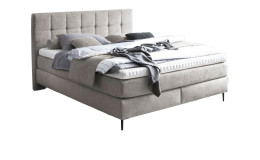 Basis-Boxspringbett MONDO Barell-Almeria in einem beigen Bezugsstoff.