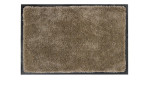 Die Astra Fußmatte Lava 60 x 80 cm ist eine rechteckige beigefarbene Polyester-Fußmatte mit zotteliger Struktur und schwarzem Rand.