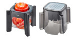 Zwei GEFU Tricut-Behälter in Grau und Schwarz: einer enthält geschnittene Tomaten mit perforiertem Deckel, der andere ist leer mit Deckel.