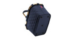 Der Reisenthel Einkaufskorb Carrybag ist eine marineblau gesteppte Tasche mit goldenen Griffen und vier runden Füßen.