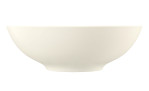 Die Seltmann Schüssel Zoe Diamond 30 cm ist eine schlichte, cremefarbene Porzellanschale mit einer glatten, geschwungenen Form.