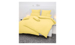 Seersucker Bettwäsche Piano in der Größe 135 x 200 cm und in der Farbausführung Gelb, auf einem Bett bezogen