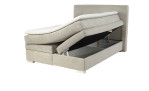 Boxspringbett Alice in der Farbe Greige mit geöffnetem Bettkasten rechts