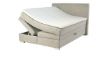 Boxspringbett Alice in der Farbe Greige mit geöffnetem Bettkasten links