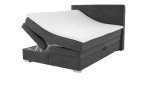 Boxspringbett Alice in der Farbe Grau mit geöffnetem Bettkasten links