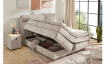 Boxspringbett Quinto Mix in der Farbe Beige in einem Zimmer mit geöffnetem Bettkasten
