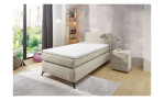 Boxspringbett Nilo in der Farbe beige, in einem Raum stehend