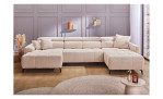 Wohnlandschaft „Umina“, modernes beiges Sofa mit verstellbaren Kopfstützen, in einem stilvollen Raum mit hellen Holzböden.