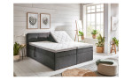 Boxspringbett Gabriella, in der Farbausführung Taupe, in einem Raum stehend mit der motorischen Funktion