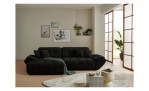 Wohnlandschaft Poppy in Schwarz mit Ottomane links, Microfaser-Wohnlandschaft im Wohnzimmer mit Couchtisch und Teppich.
