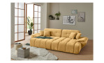Wohnlandschaft Poppy in Beige mit Relaxfunktion und Ottomane rechts im hellen Raum mit Holzfußboden.