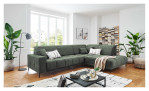 Ecksofa Luan in einem grünen Cordstoff. Auf einem dekorierten Hintergrund