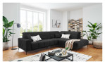 Wohnlandschaft Luan in Anthrazit mit Cord-Optik, inszeniert auf gemustertem Teppich mit schwarzem Couchtisch und Stehlampe.