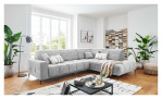 Wohnlandschaft Luan in Hellgrau mit Cord-Optik, inszeniert auf gemustertem Teppich mit schwarzem Couchtisch und Stehlampe.