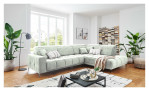Wohnlandschaft Luan in Weiß mit Cord-Optik, inszeniert auf gemustertem Teppich mit schwarzem Couchtisch und Stehlampe.