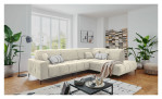 Wohnlanfschaft Luan in Creme in Cord-Optik, inszeniert auf gemustertem Teppich mit schwarzem Couchtisch und Stehlampe.