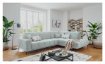 Wohnlanfschaft Luan in Mint in Cord-Optik, inszeniert auf gemustertem Teppich mit schwarzem Couchtisch und Stehlampe.
