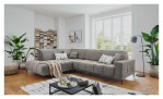 Wohnlandschaft Luan in Dunkelbraun mit Cord-Optik, inszeniert auf gemustertem Teppich mit schwarzem Couchtisch und Stehlampe.