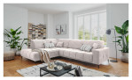 Wohnlandschaft Luan in Rosa mit Cord-Optik, inszeniert auf gemustertem Teppich mit schwarzem Couchtisch und Stehlampe.