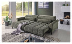 Komfort-Wohnlandschaft Lilly in einem grünen Cordstoff mit zwei Zierkissen und gezeigter Funktion. Auf einem dekorierten Hintergrund.