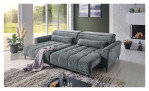 Komfort-Wohnlandschaft Lilly in einem grauen Cordstoff mit zwei Zierkissen und gezeigter Funktion. Auf einem dekorierten Hintergrund.