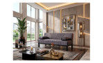 Modernes Wohnzimmer mit dem Schlafsofa „Ruben“ (200 × 90 × 85 cm), abstrakter Kunst, Pflanzen und stilvollen Akzenten.